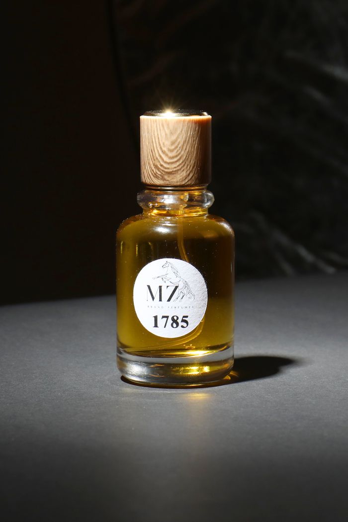 about-us A luxurious glass bottle filled with aromatic oil, perfect for relaxation and traditional treatments.