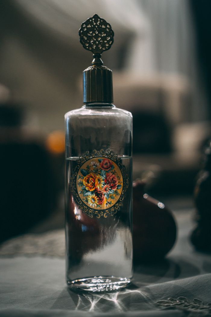services-02 Elegant glass bottle with intricate floral design. Perfect for vintage decor themes.